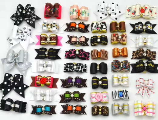 Assorted colorful dog grooming bows and ties with various patterns and embellishments.